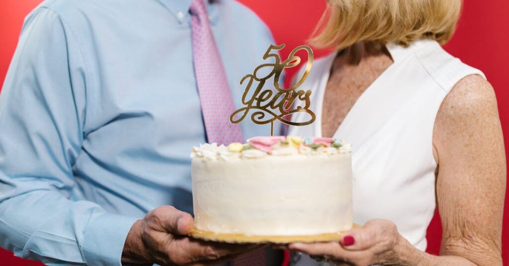 A couple celebrating their 50th anniversary with a decorative cake, symbolizing a lasting bond.